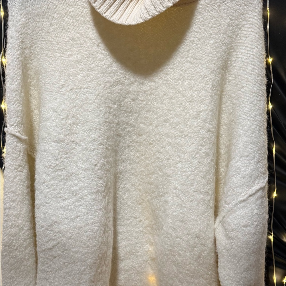 39.Pre loved Free People Cream Turtleneck Sweater